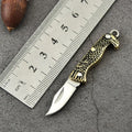 Brass mini folding knife keychain pendant with 3cm blade and 50mm or 60mm full length in five brass handle styles.