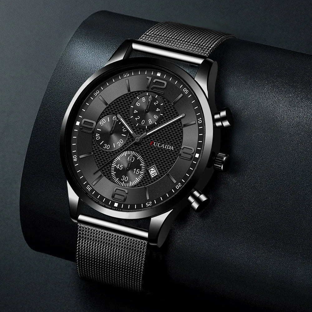 Men's gold shell quartz watch with black dial and mesh alloy strap on a white background