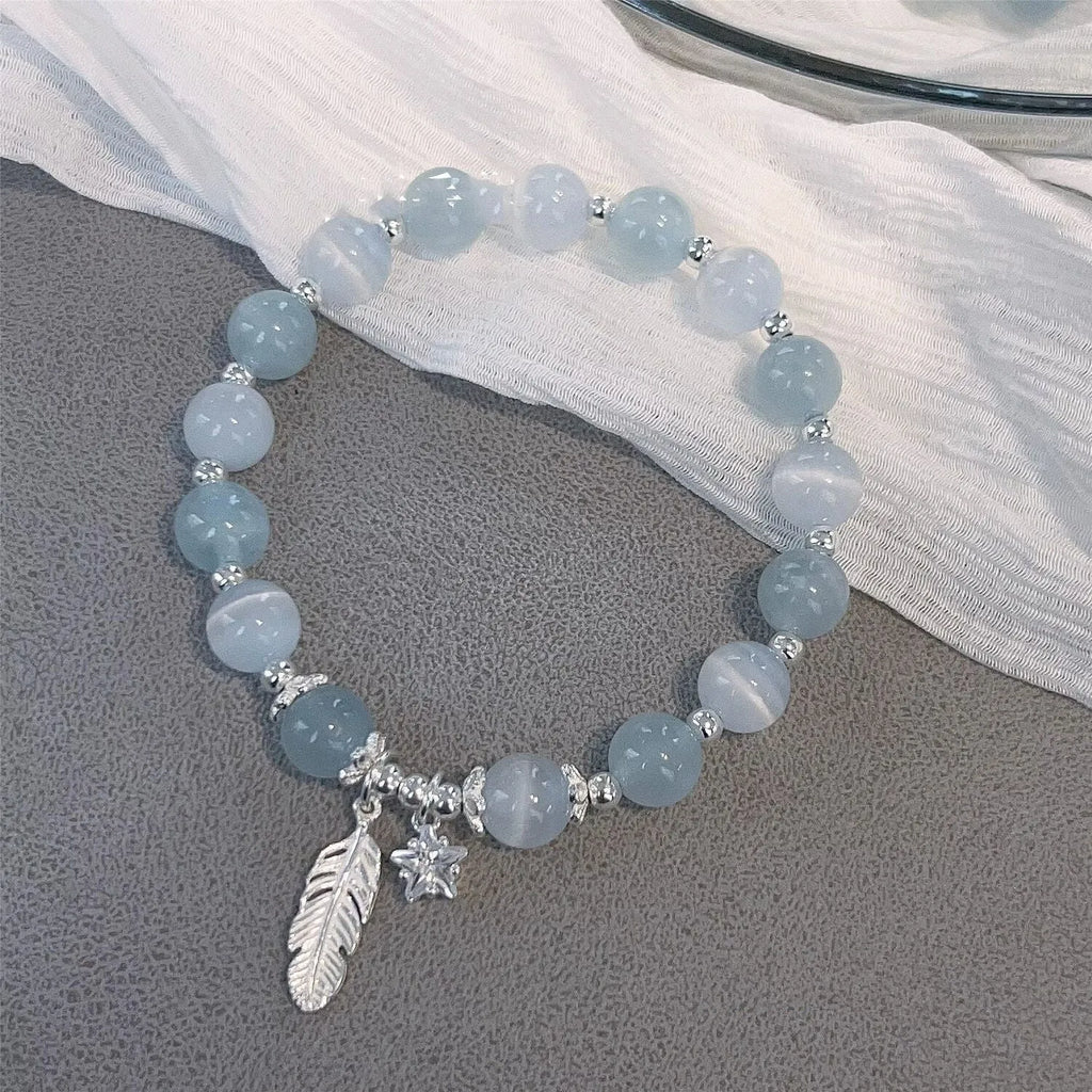 Korean style crystal bracelet with feather XINGX blue moonlight colour and eight Awn star design