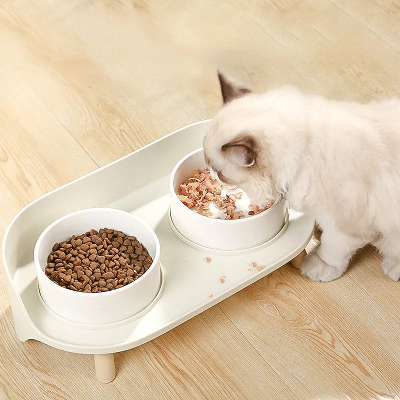 Green adjustable double-bowl pet feeder with tilted design for cervical support