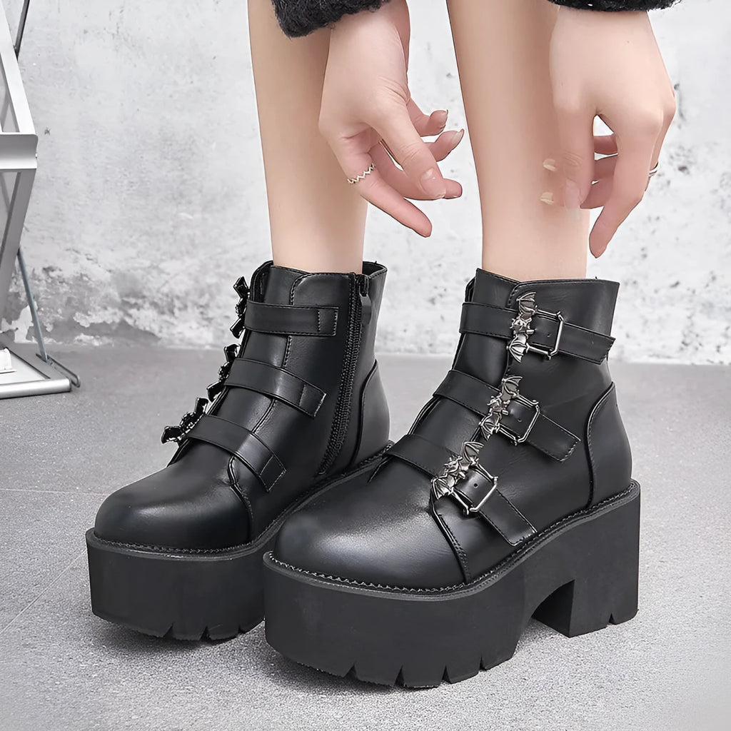 Black ladies punk Martin boots with bat buckle, thick heel, side zip, and round toe.