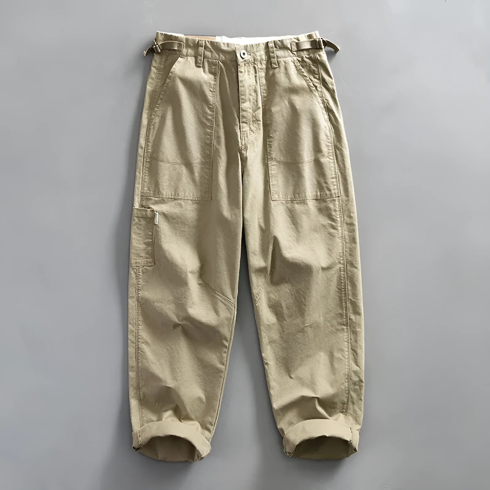 Men's straight-leg cotton casual trousers in apricot, shown flat.