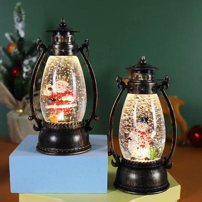 Portable crystal ball oil lamp Christmas decoration on a desktop, showing snowman and elderly figure options.