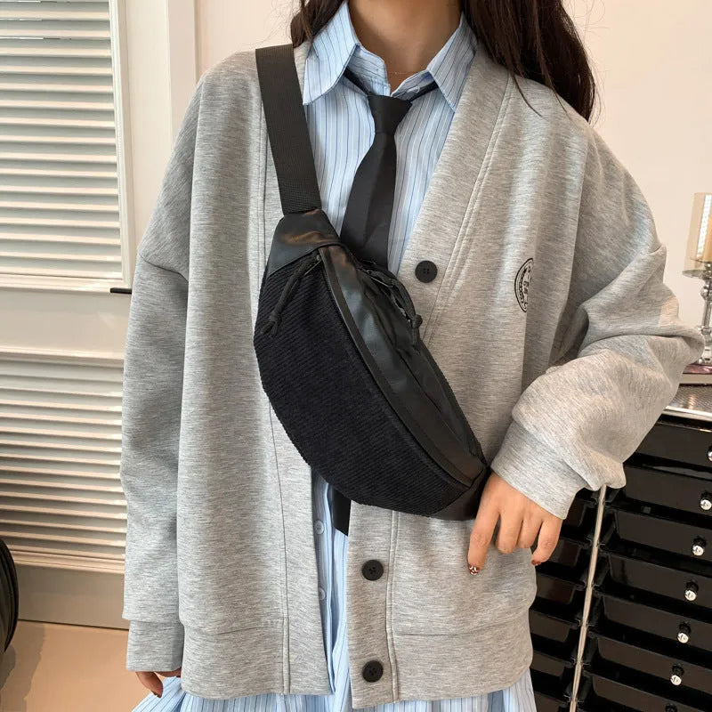 Corduroy crossbody bag in brown with oval shape, slit pocket, and crossbody strap