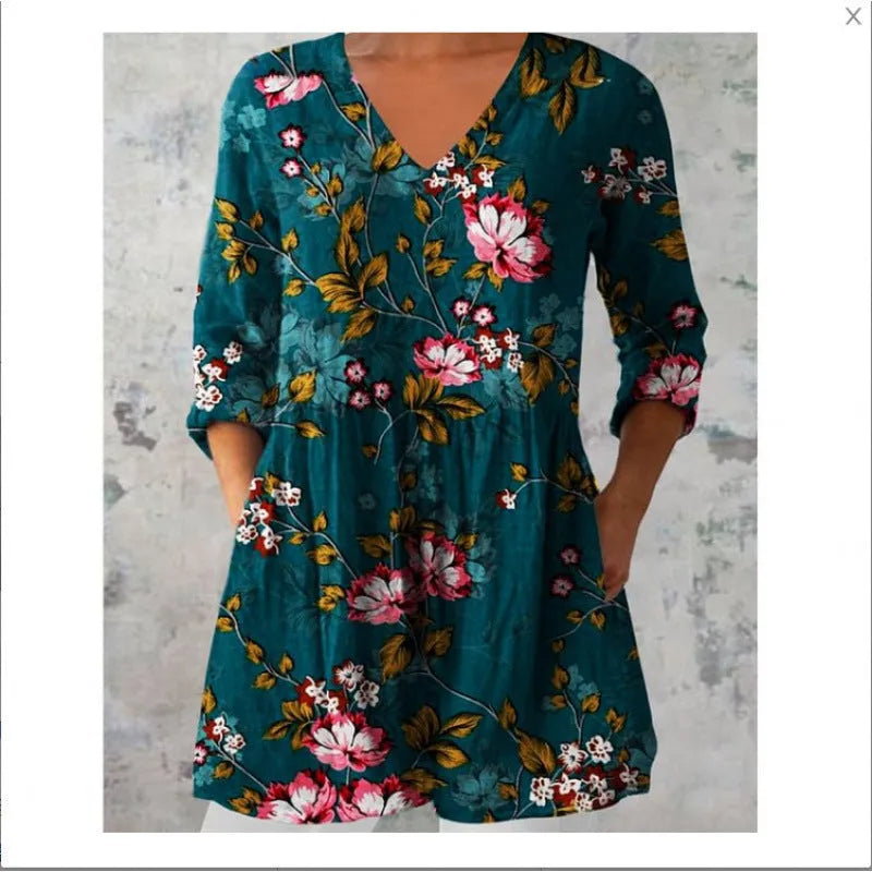 Women's loose-fitting dress with a wave print pattern, wide waist, and three-quarter length sleeves.