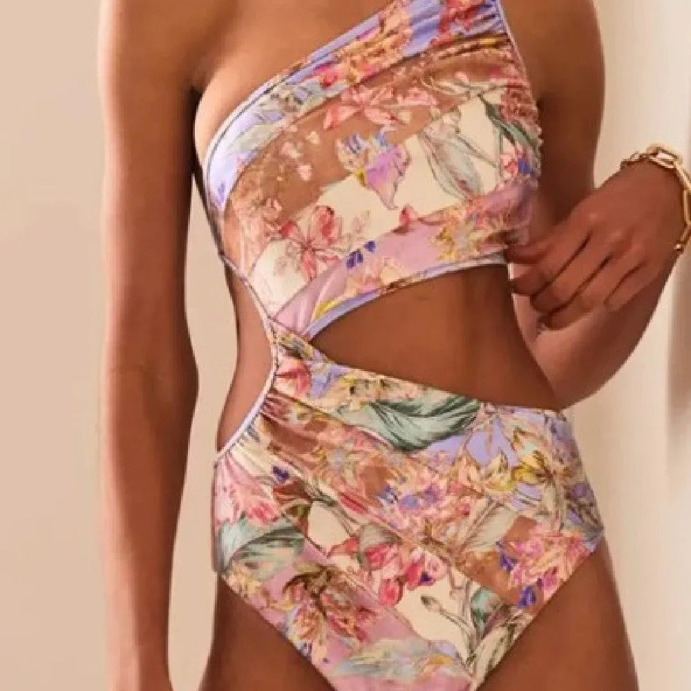 Rose gold patterned women's one-piece swimsuit on a mannequin.
