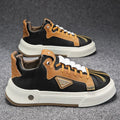 Men's beige low-top slip-on sneakers with elastic band and round toe on a plain background.