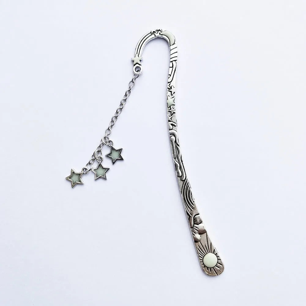 Retro five-pointed star glowing metal bookmark in ancient silver and bronze colours with celestial patterns
