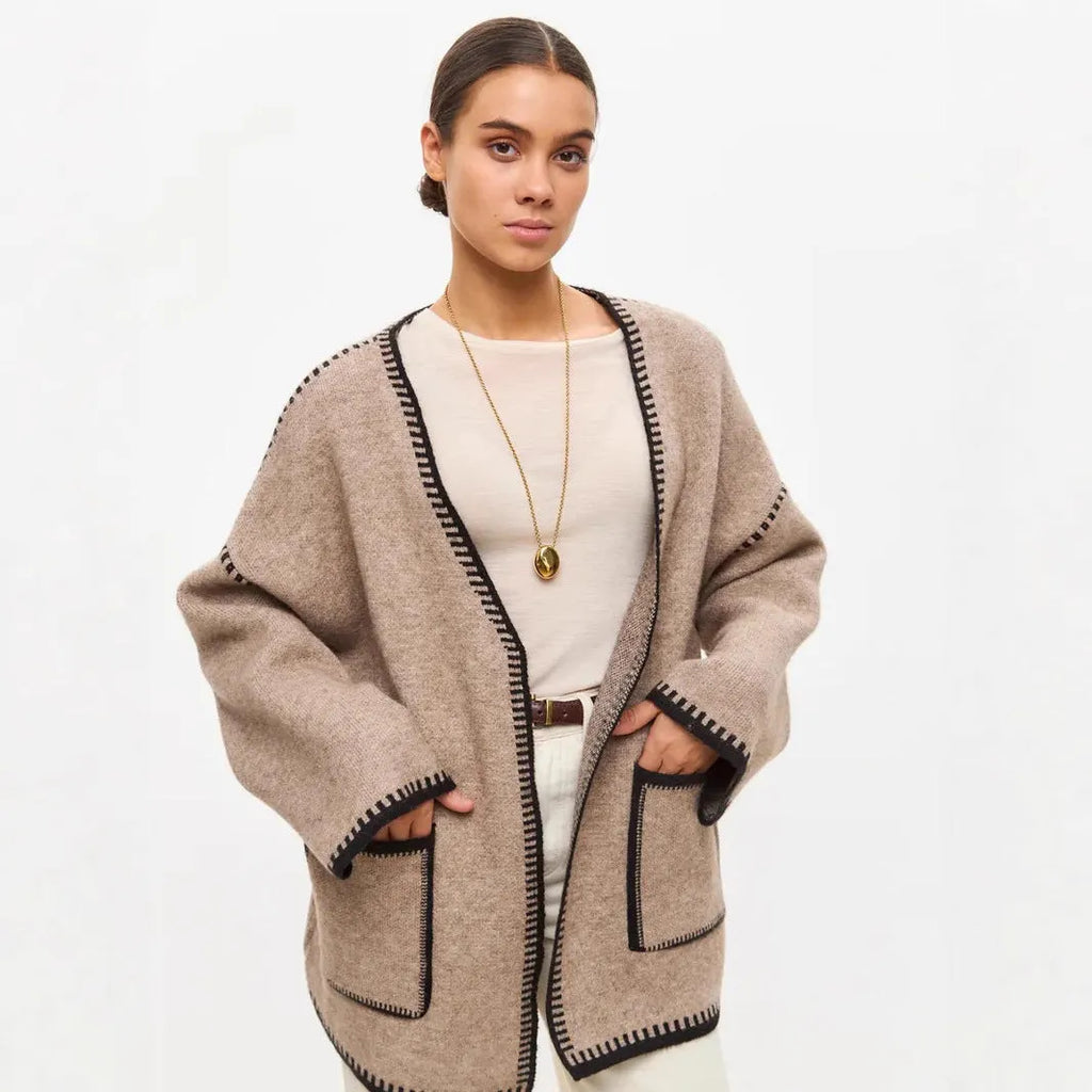 Loose lace-up knitted cardigan sweater coat in camel colour showing front detail