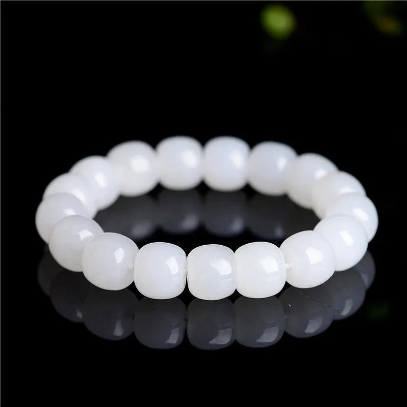 White Hetian jade barrel bead bracelet for men and women showing polished beads.