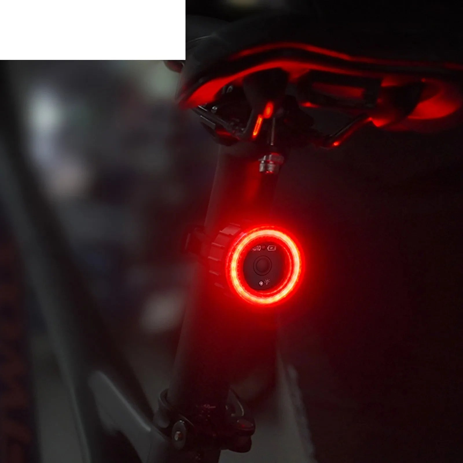 Black aluminium alloy bicycle induction brake taillight with seat tube mounting bracket.