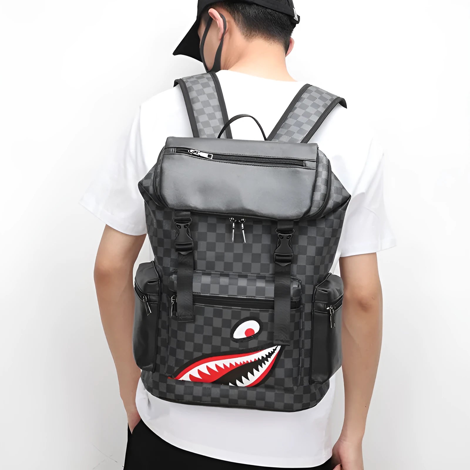 Black checkered printed PU leather backpack with curved shoulder straps shown from front perspective