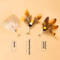 Three steel wire cat toy replacement heads shaped like small flying insects.