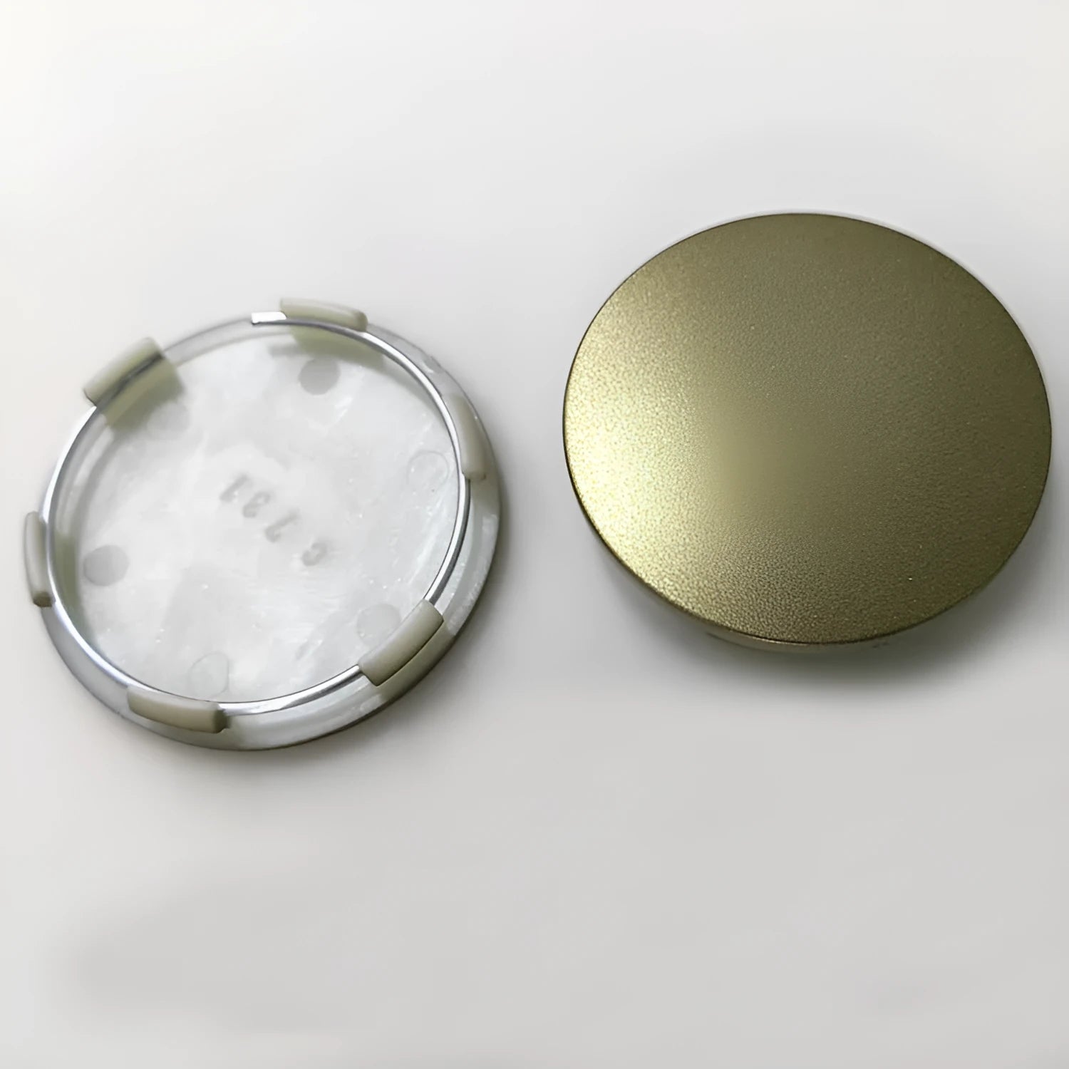 65mm diameter ABS plastic car hub centre cover in antique copper colour with aluminium label.