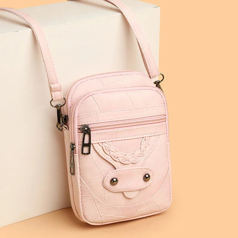 Soft brown PU leather square vertical mobile phone bag with woven detailing and rivets.