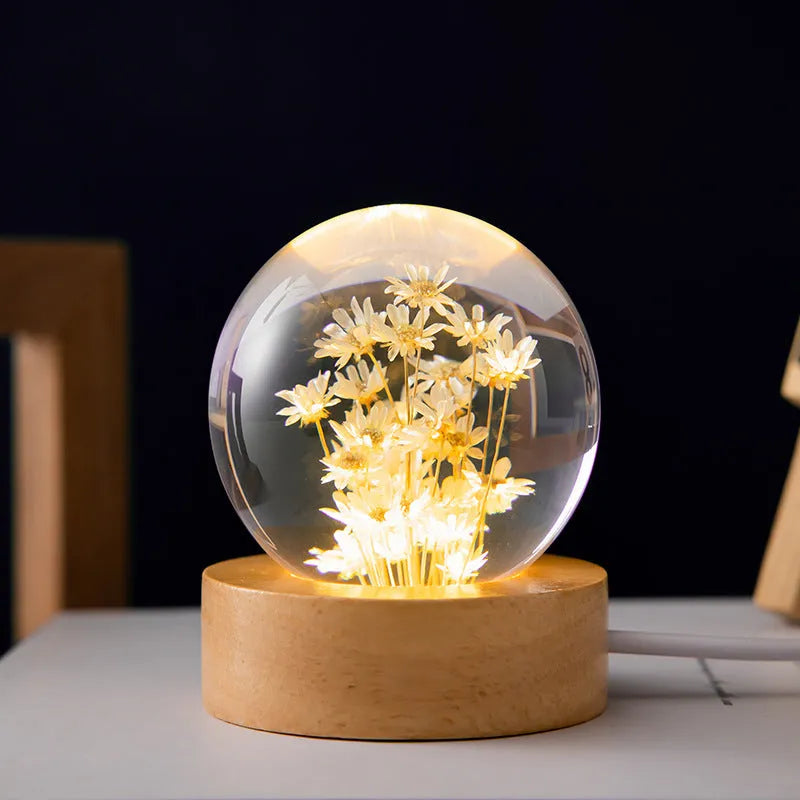 Luminous dandelion preserved in a resin crystal ball on a beech wood stand, USB powered.