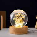 Luminous dandelion preserved in a resin crystal ball on a beech wood stand, USB powered.