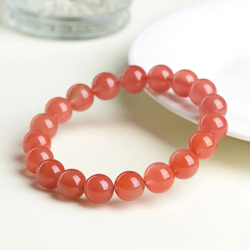 Polished South cherry red agate scattered bead bracelet shown in single and triple circle styles.