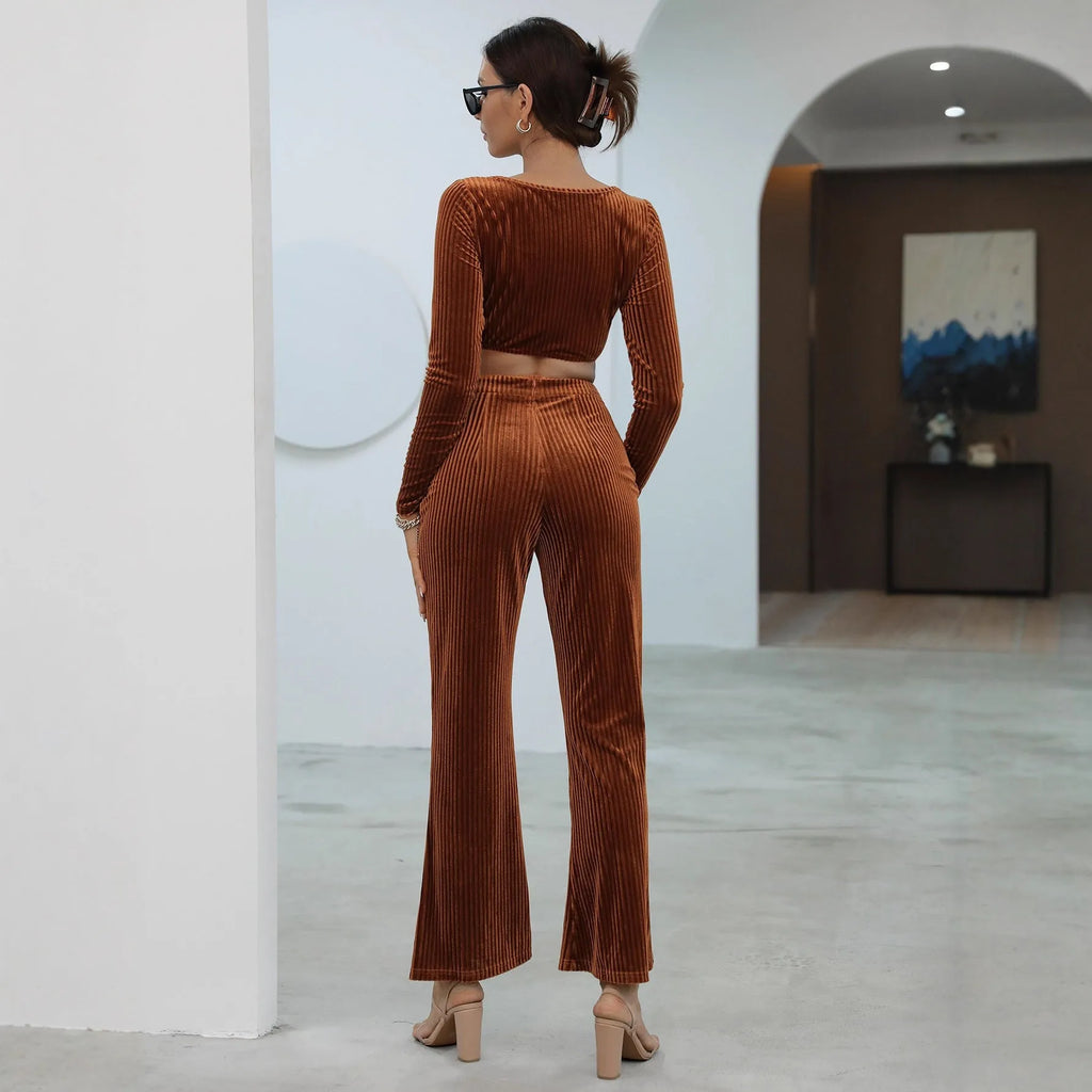 Caramel coloured long sleeve sweater and matching trousers casual set laid flat.