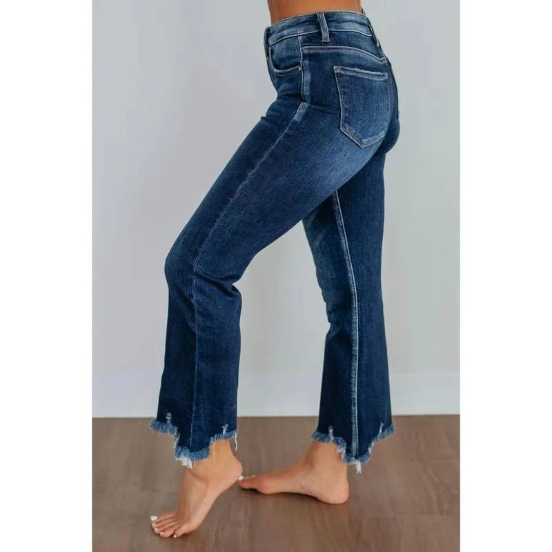 Women's solid colour denim trousers with hand-distressed detailing in dark blue wash
