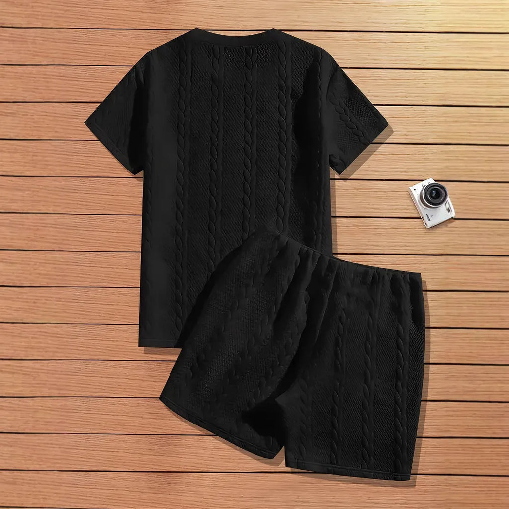 Men's black two-piece sports set with short sleeve T-shirt and matching shorts featuring patch design