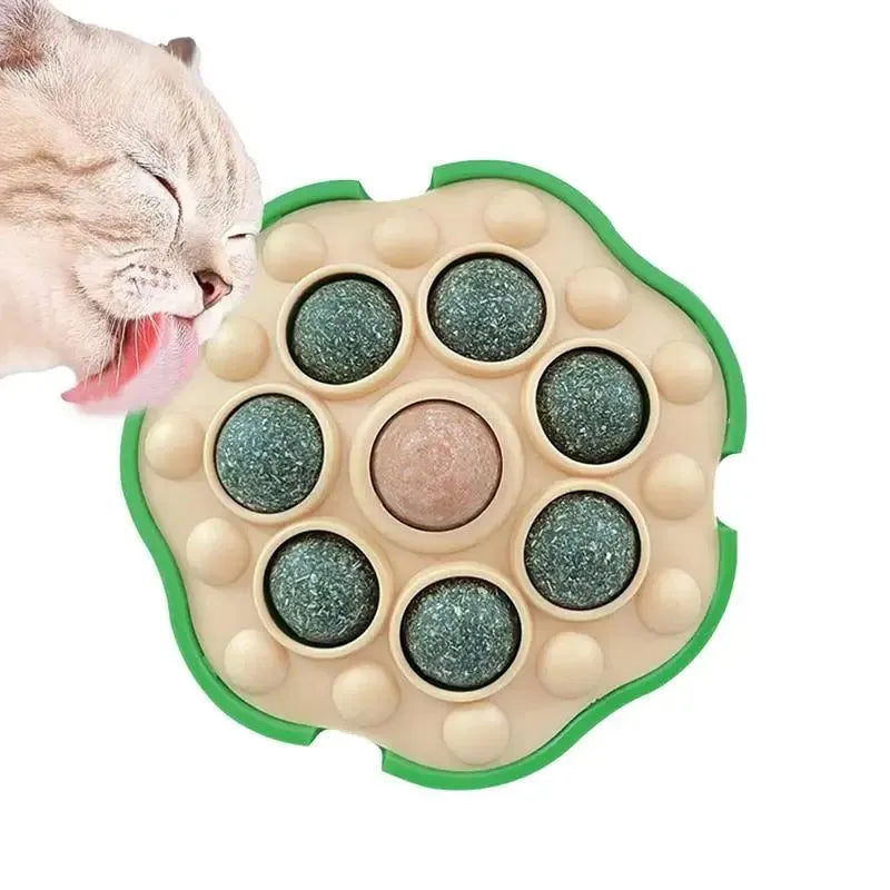 Green lotus-shaped catnip ball with stick-on wall backing for indoor cats