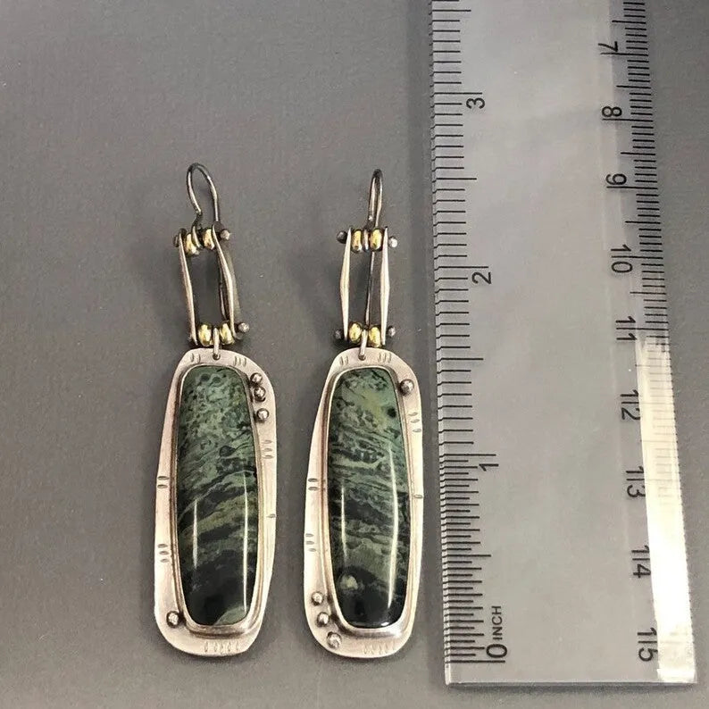 Geometric drop earrings with a two-tone marble pattern finish, made from silver-toned alloy.
