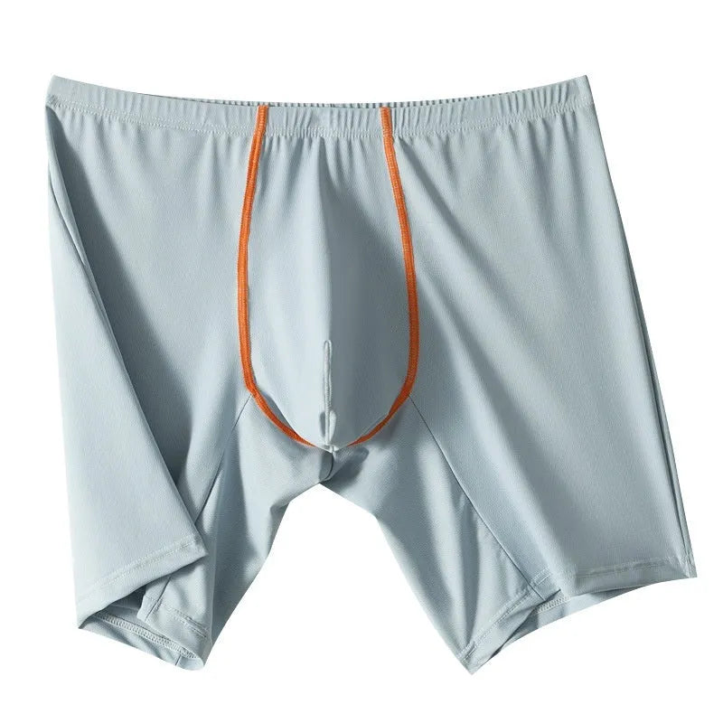Men's mid-waist nylon boxer shorts in light green with a U-convex pouch, laid flat.
