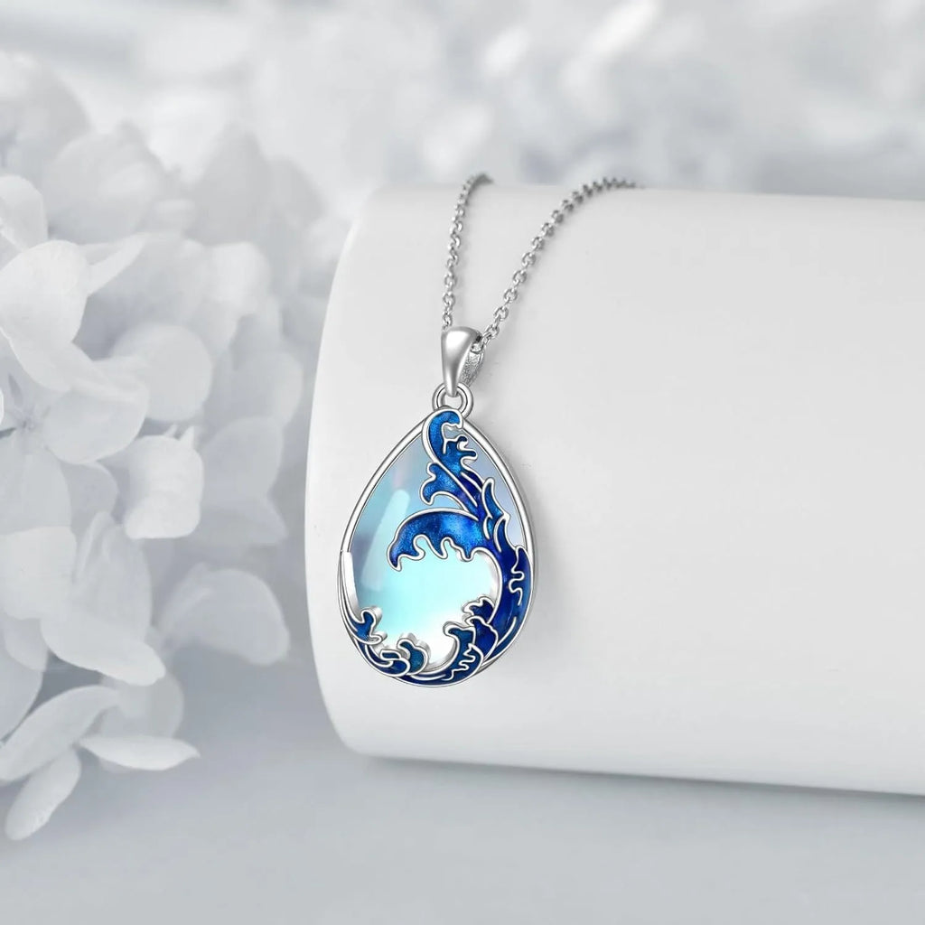 Moonstone blue heart-shaped alloy pendant on a women's necklace.