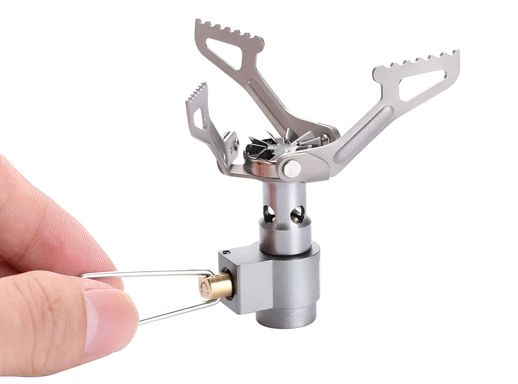 Portable mini camping gas stove in silver metal, 25g weight, for outdoor propane cooking