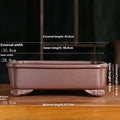 Antique rectangular purple sand clay bonsai pot on a floor, shown in two size options.