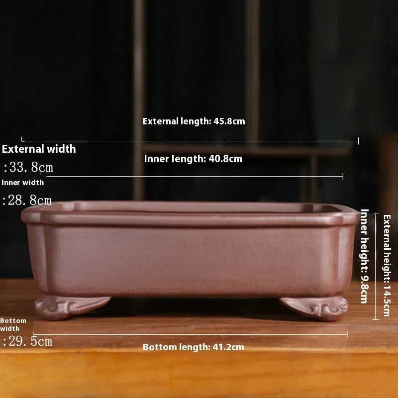 Antique rectangular purple sand clay bonsai pot on a floor, shown in two size options.