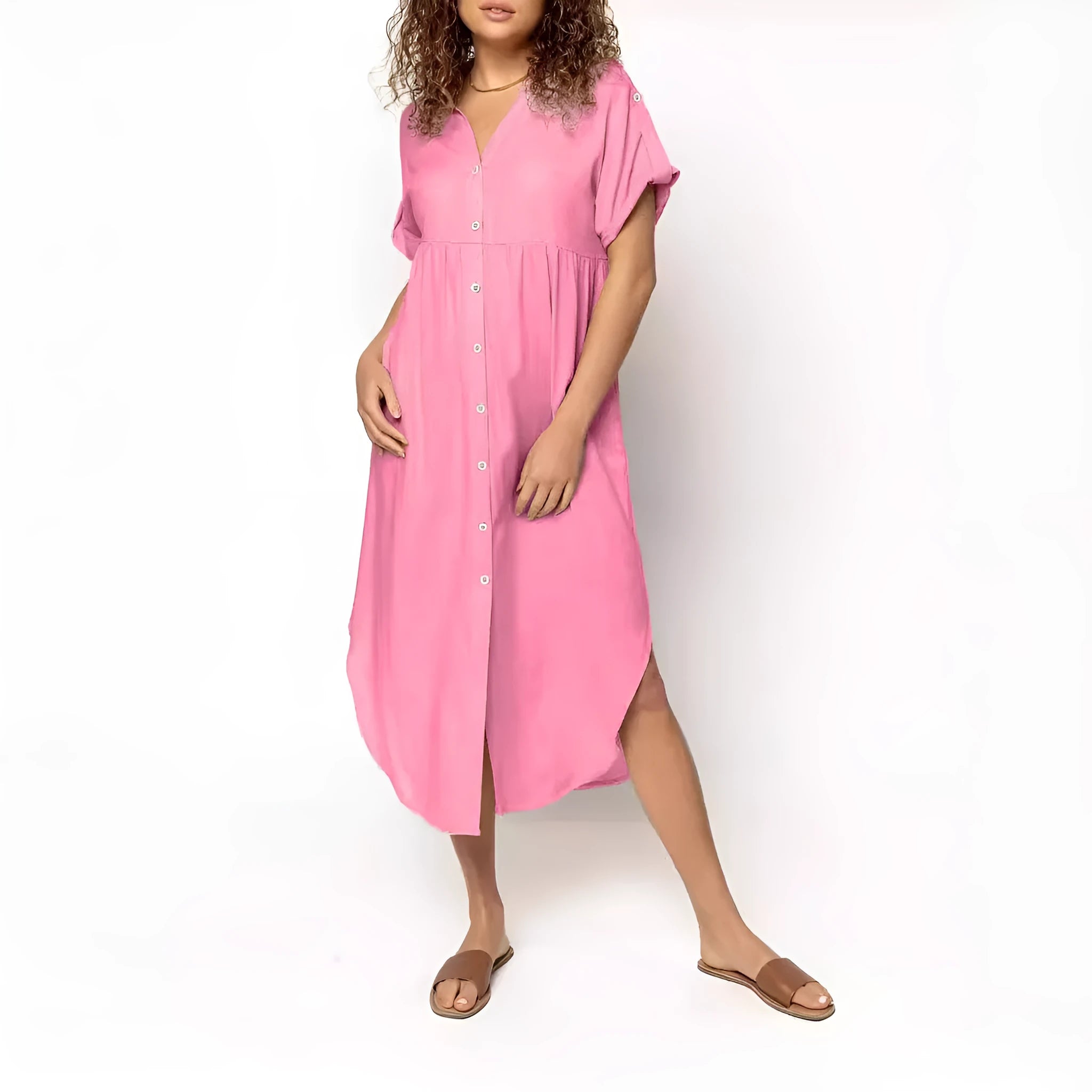 Loose mid-length casual dress in solid colour with button front detail, shown on a hanger.
