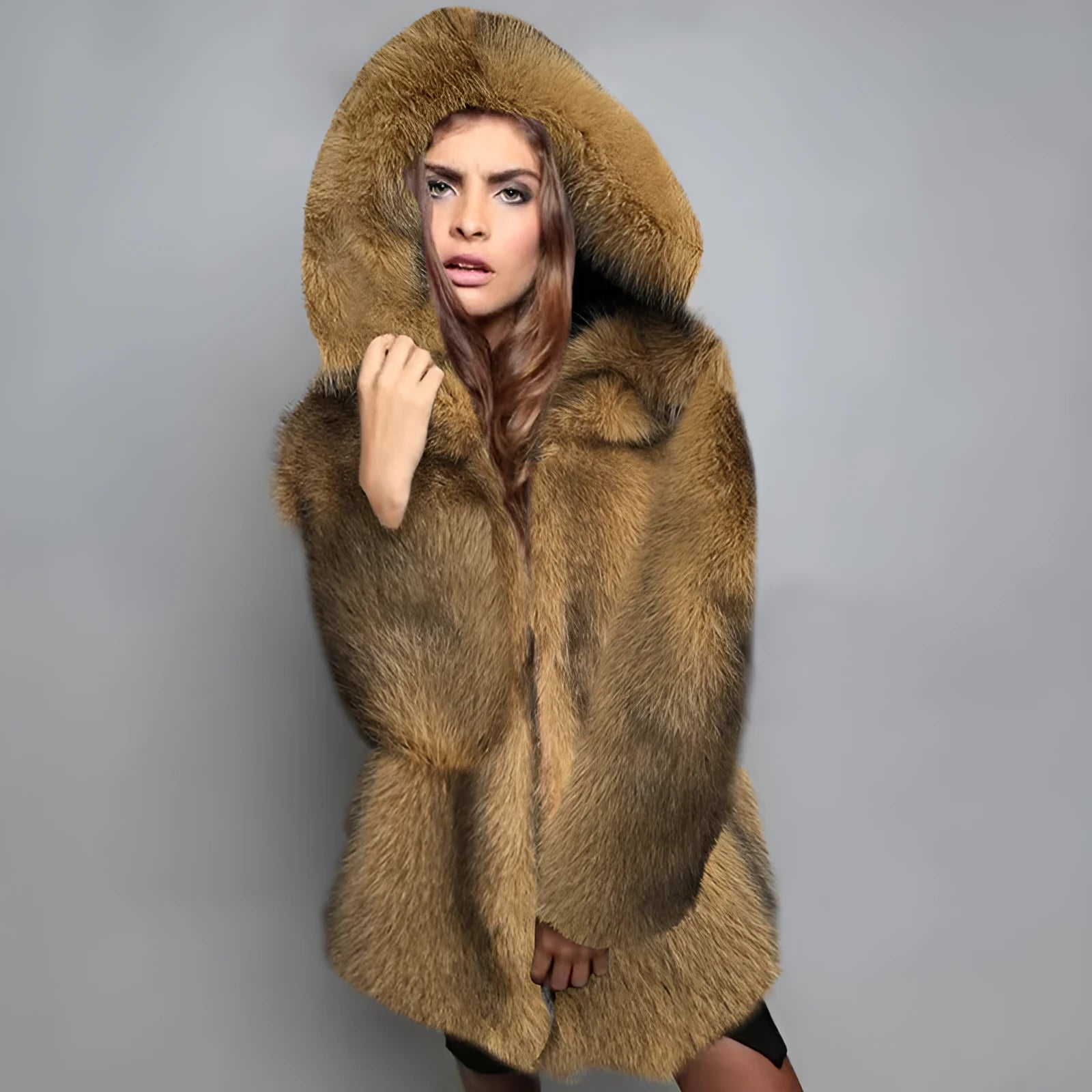 A woman wearing a silver grey loose-fit mid-length artificial fur coat.