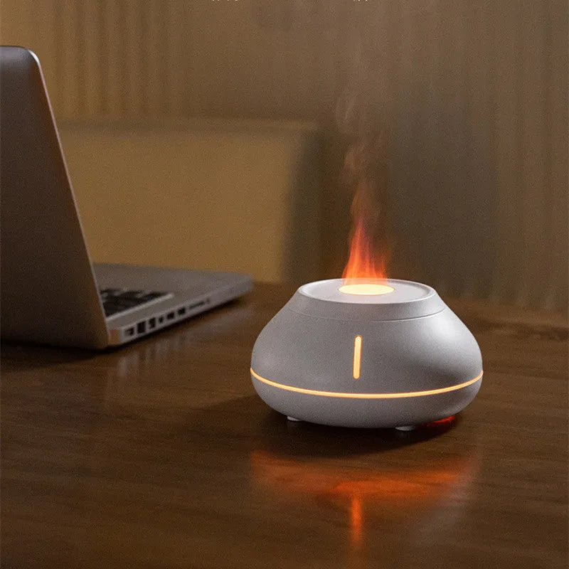 Round aromatherapy diffuser with LED flame simulation effects in black, cracked black or white colour options