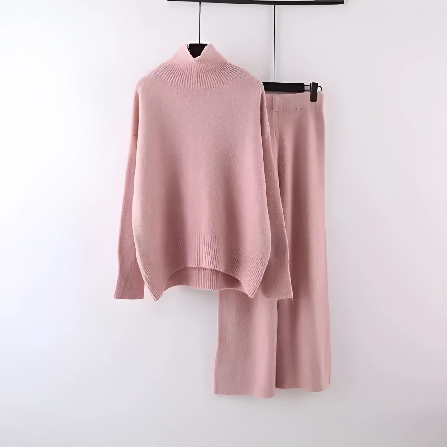 Women's milky white acrylic fibre sweater and wide-leg trousers two-piece casual set on a hanger.
