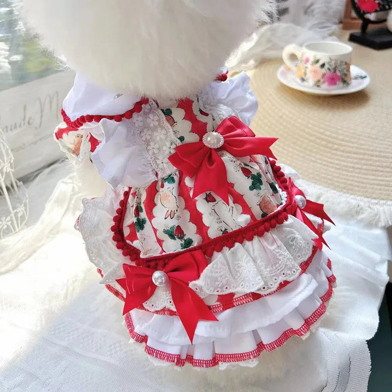 Small white dog wearing a light pink rabbit skirt princess-style polyester dress.