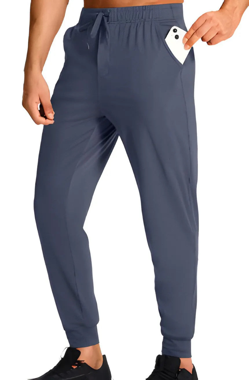Men's loose fit solid colour casual polyester trousers on a hanger.