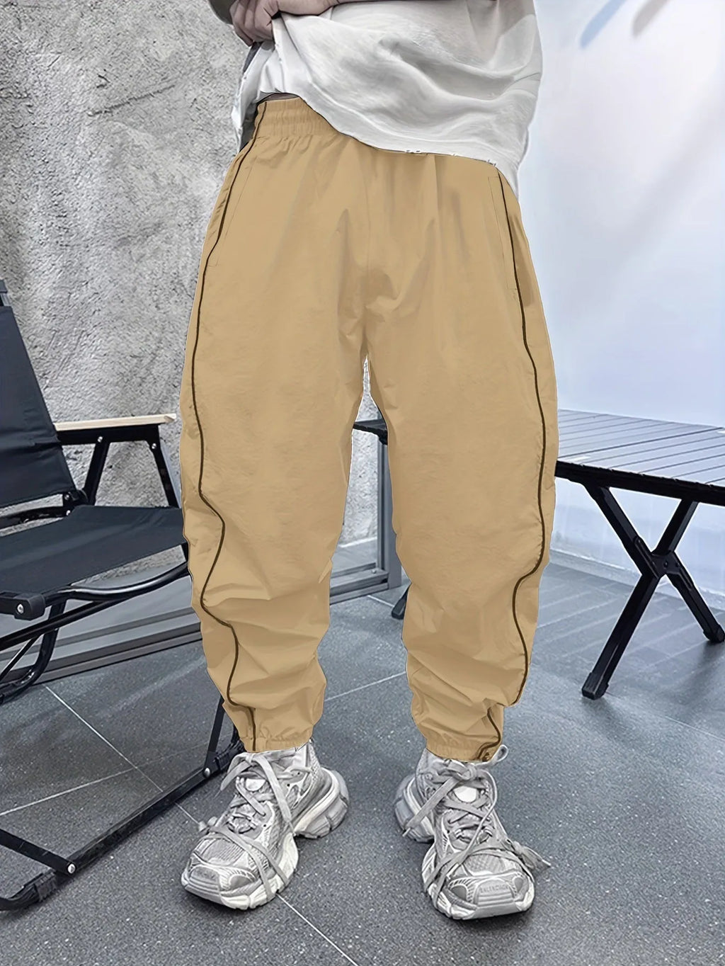 Men's blue bamboo fibre cropped casual sports trousers on a hanger.
