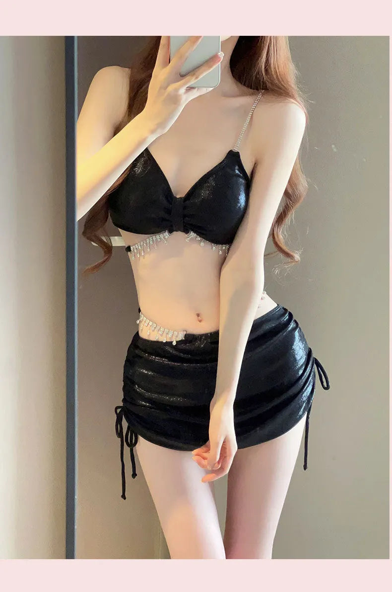 Women's solid colour polyester bikini swimsuit set in pink and black options.