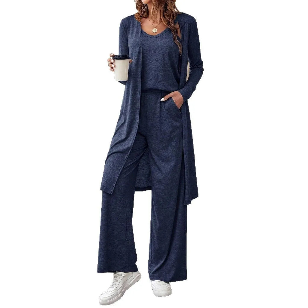 Blue women's three-piece suit set with top, trousers, and suspenders on a hanger