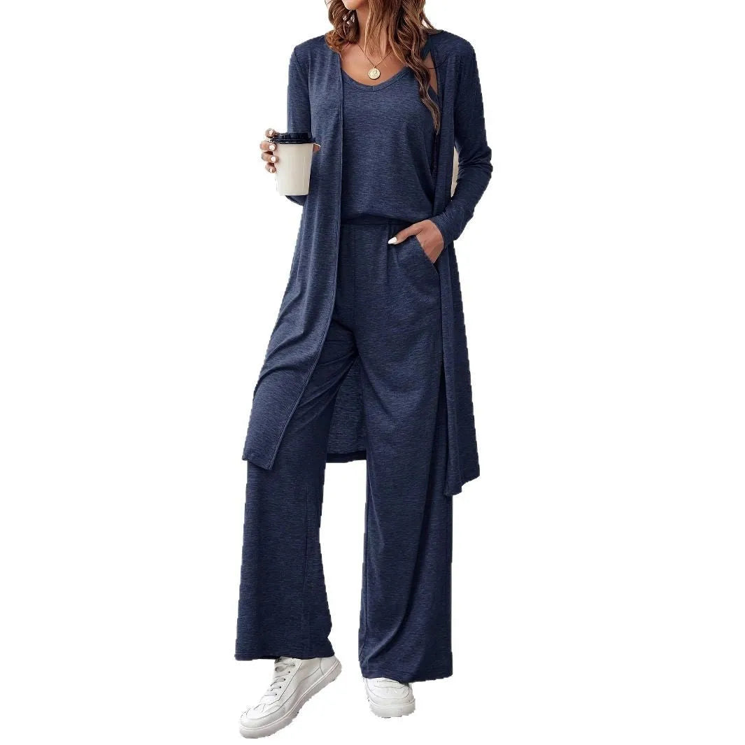 Blue women's three-piece suit set with top, trousers, and suspenders on a hanger