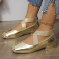 Gold slip-on evening pumps with a flared skirt collar, square toe and low rubber sole.