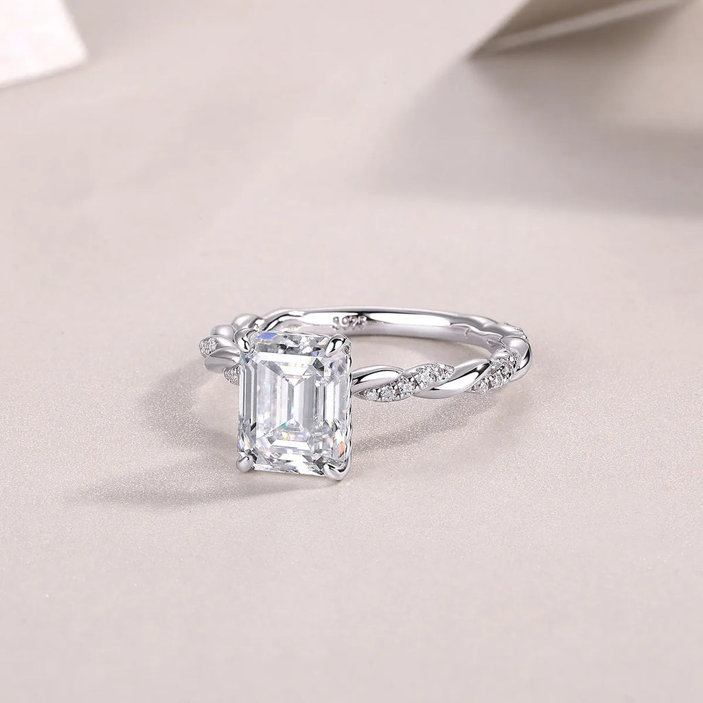 Octagonal moissanite wedding ring set in S925 silver with platinum plating, 7x9mm stone, sizes 5-9, gift box and GRA certificate.