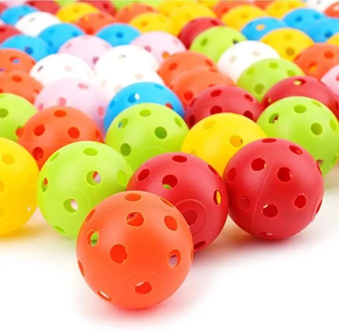 Assortment of red, orange, blue, green, white, and yellow 26-hole golf practice balls in a net bag.