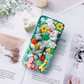 Pink and green 3D silicone phone cases with raised cartoon rabbit designs for iPhone.