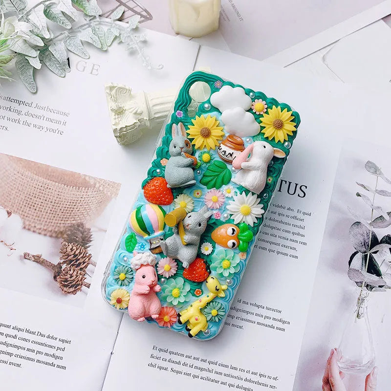 Pink and green 3D silicone phone cases with raised cartoon rabbit designs for iPhone.