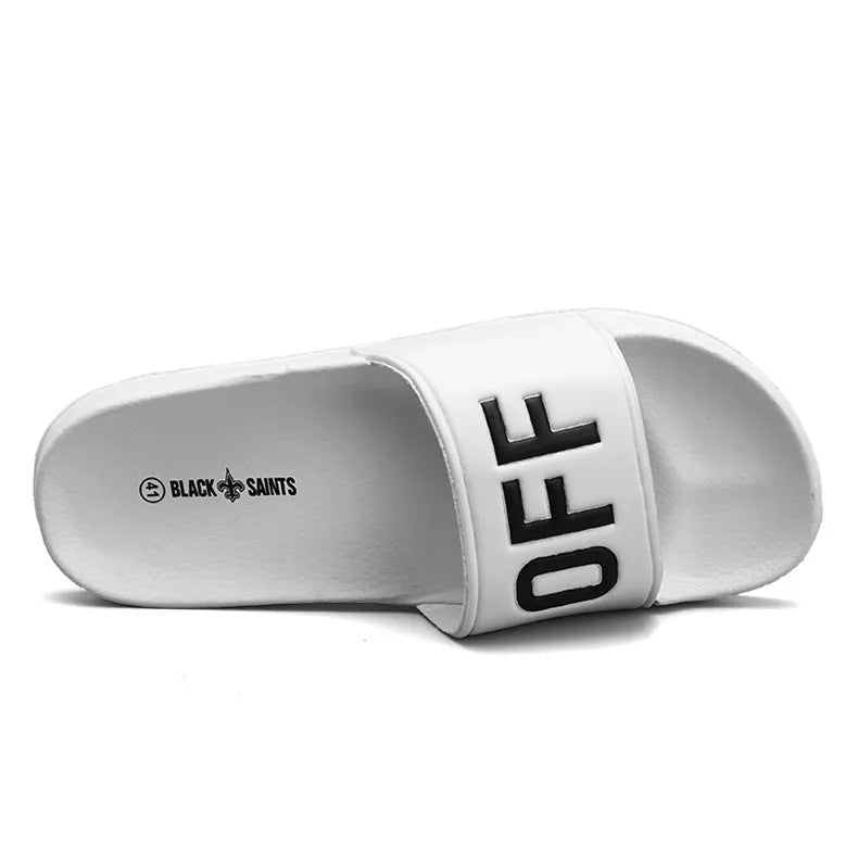 Large black and white open-toe men's slippers with a rubber sole, showing size range 36 to 46.