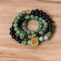 Green and black alloy bead elastic bracelet on a black stretch cord.