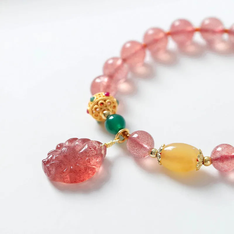 Women's strawberry quartz crystal bracelet with Nine Tail Fox beaded design